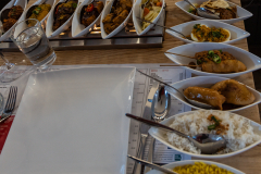 15 Course Rijsttafel (Rice Table) is the most iconic Indonesian dining experience in Amsterdam.  It consists of numerous small dishes served with rice, allowing diners to sample a wide variety of flavors.